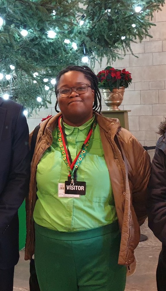 Photo of former supported intern during visit to parliament