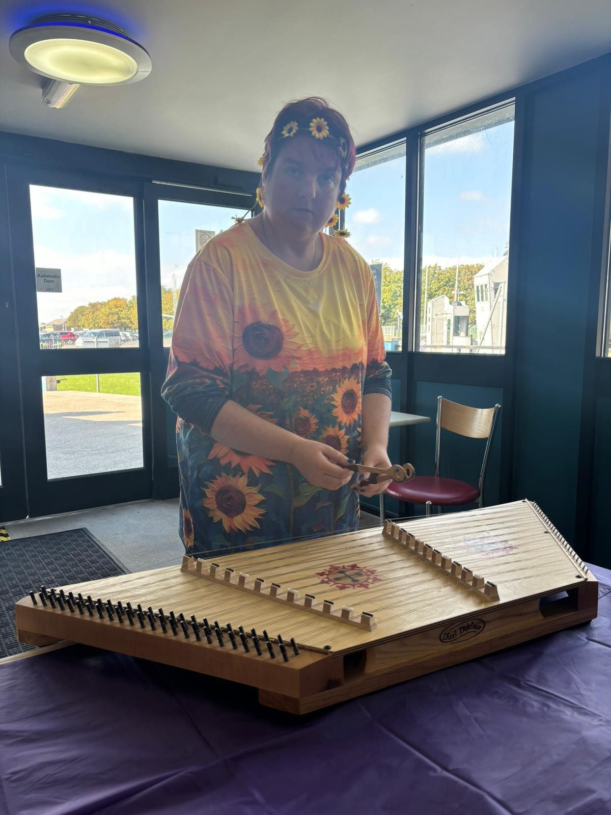 Sam Avery, the Service Quality Director, attended a fun day at the Fleet Air Arm Museum. Sam is dressed as a sunflower with a yellow and green jumper with sunflowers on and a sunflower headband.